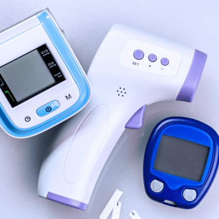 Three types of medical devices, one next to the other, on a table.