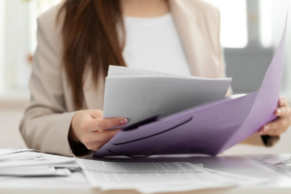 woman reading regulatory documents